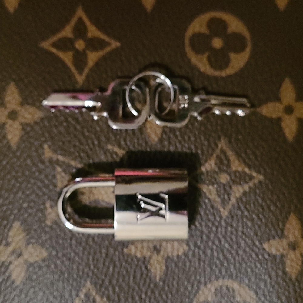 LV silver Louis Vuitton lock and key rare